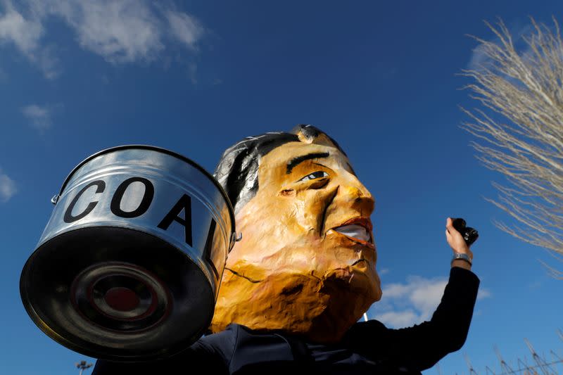 FILE PHOTO: Activists take part in a protest to demand Japan to stop supporting coal, outside the venue of the U.N. climate change conference (COP25) in Madrid