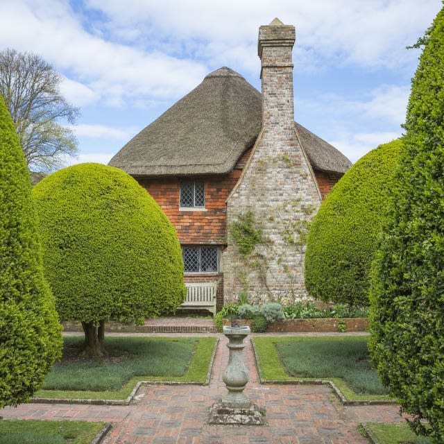 The sundial surrounded by topiary yew hedges at Alfriston Clergy House