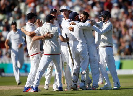 Britain Cricket - England v Pakistan - Third Test - Edgbaston - 7/8/16 England's Moeen Ali celebrates taking the wicket of Pakistan's Sohail Khan and winning the third test with team mates Action Images via Reuters / Paul Childs