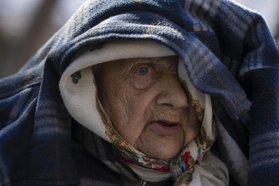 Sofia Boiko, 90, arrives at the Ukrainian Red Cross center in Mykolaiv, southern Ukraine, on Monday, March 28, 2022. Boiko evacuated with others from regions that have been attacked by the Russian army in Mykolaiv district. (AP Photo/Petros Giannakouris)