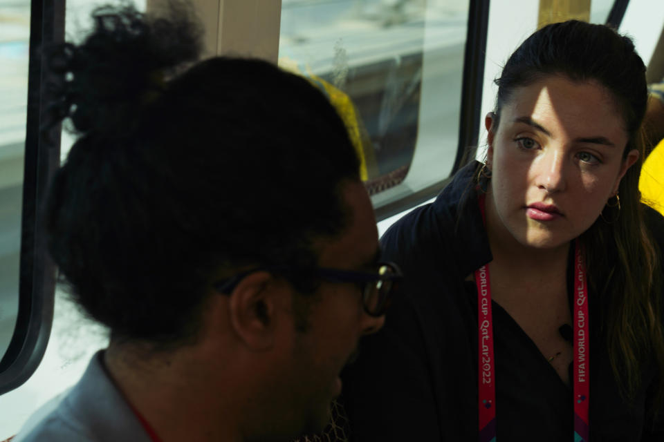 Associated Press correspondent Isabel DeBre conducts an interview in the Doha Metro in Doha, Qatar, Monday, Nov. 28, 2022. With Qatar's World Cup the most compact tournament in the competition's history, DeBre set out to see four matches in one day. (AP Photo/Jon Gambrell)