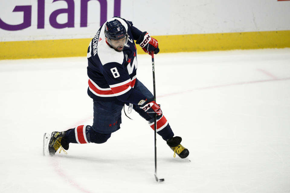 Washington Capitals left wing Alex Ovechkin (8) shoots during the first period of an NHL hockey game against the Detroit Red Wings, Monday, Dec. 19, 2022, in Washington. (AP Photo/Nick Wass)