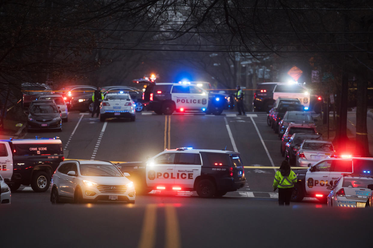 Police gather at the scene of a shooting on a bus in Washington, D.C., on Jan. 11, 2023. 