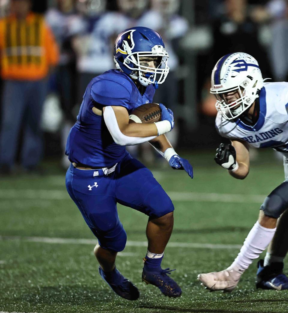 Madeira running back Max Autry runs the ball in a football game with Reading Friday, Sept.23.