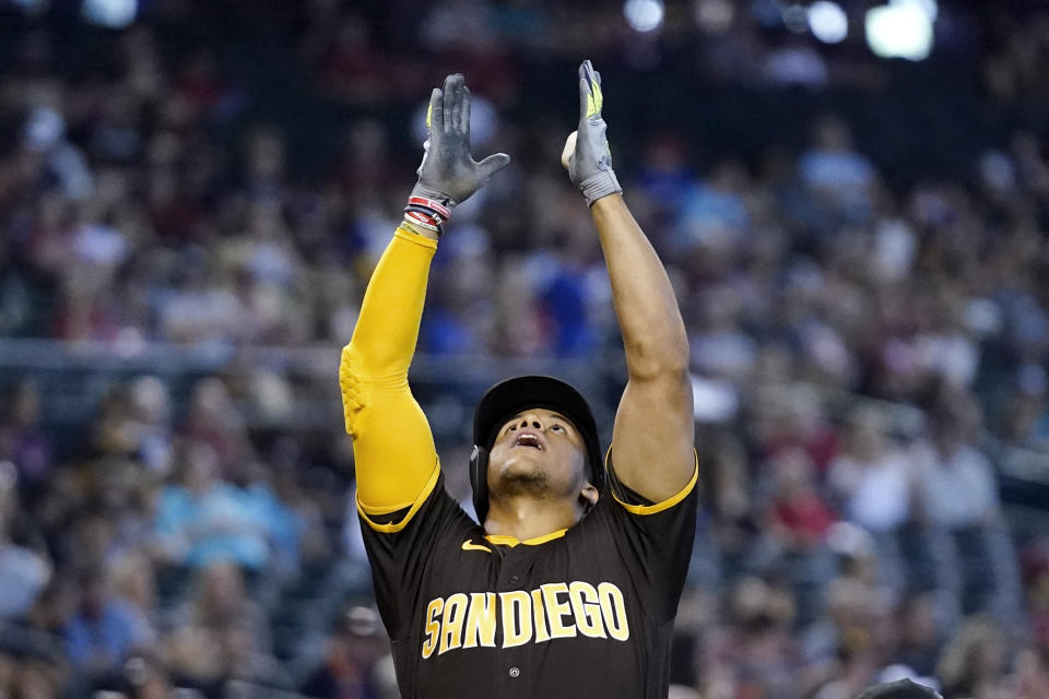 San Diego Padres' Juan Soto celebrates after his home run against the Arizona Diamondbacks during the fifth inning of a baseball game in Phoenix, Sunday, Sept. 18, 2022. (AP Photo/Ross D. Franklin)