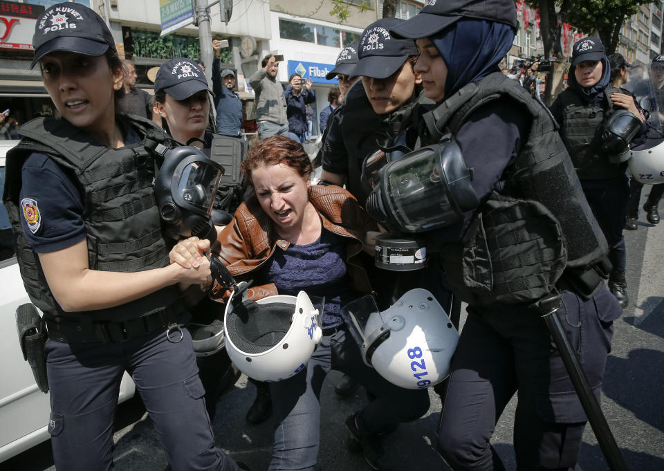 <p>Female police officers detain a woman taking part in May Day protests in Istanbul, Turkey, May 1, 2018. Police detained several demonstrators as the crowd tried to march toward Istanbul’s Taksim Square, which is symbolic as the center of protests in which dozens of people were killed in 1977.(Photo: Lefteris Pitarakis/AP) </p>