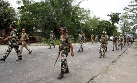 Security personnel patrol during a curfew in Baksa district in Assam May 4, 2014. REUTERS/Utpal Baruah