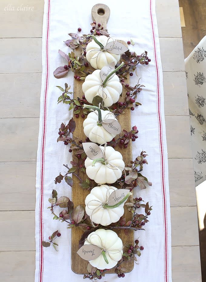 <p>Elevated on a wooden paddle, mini pumpkins stand out in a major way, especially once party guests notice the sweet phrases written on their tags. </p><p><em><a href="http://www.ellaclaireinspired.com/fall-2015-home-tour/" rel="nofollow noopener" target="_blank" data-ylk="slk:See more at Ella Claire »;elm:context_link;itc:0;sec:content-canvas" class="link ">See more at Ella Claire »</a></em></p>