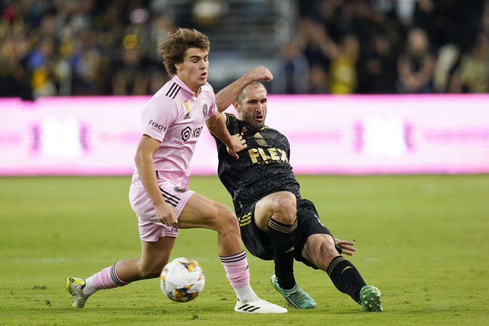 Los Angeles FC defender Giorgio Chiellini, right, slide-tackles Inter Miami midfielder Benjamin Cremaschi, left, during the first half of an MLS soccer match, Sunday, Sept. 3, 2023, in Los Angeles. (AP Photo/Ryan Sun)