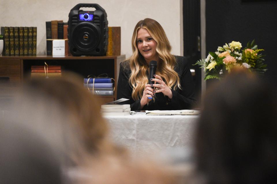 Author Audra McElyea speaks to the crowd at her book launch at Addison’s Bookstore on Gay Street, Friday, Jan. 5, 2024.