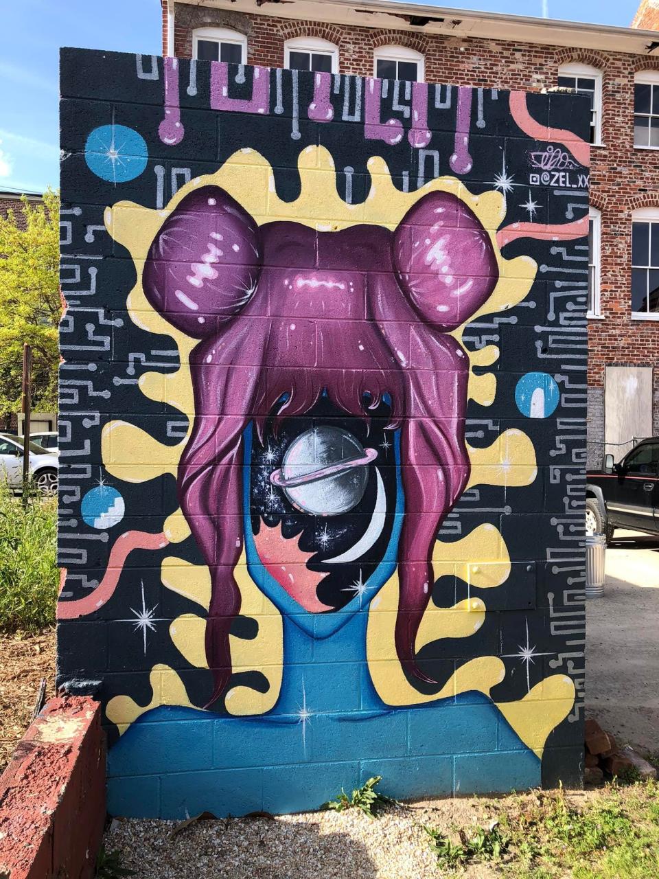 Mural by Itzel Ortiz aka SOL in Old Towne Petersburg in the Appomattox Iron Works complex.