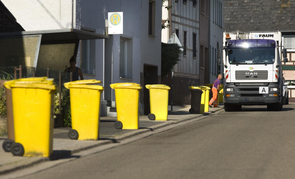 Yellow recycling bins, for packaging, plastic and metal, await collection. (Photo: ullstein bild via Getty Images)