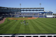 New York Yankees outfielders warm up during a spring training baseball workout Tuesday, Feb. 23, 2021, at George M. Steinbrenner Field in Tampa, Fla. (AP Photo/Frank Franklin II)