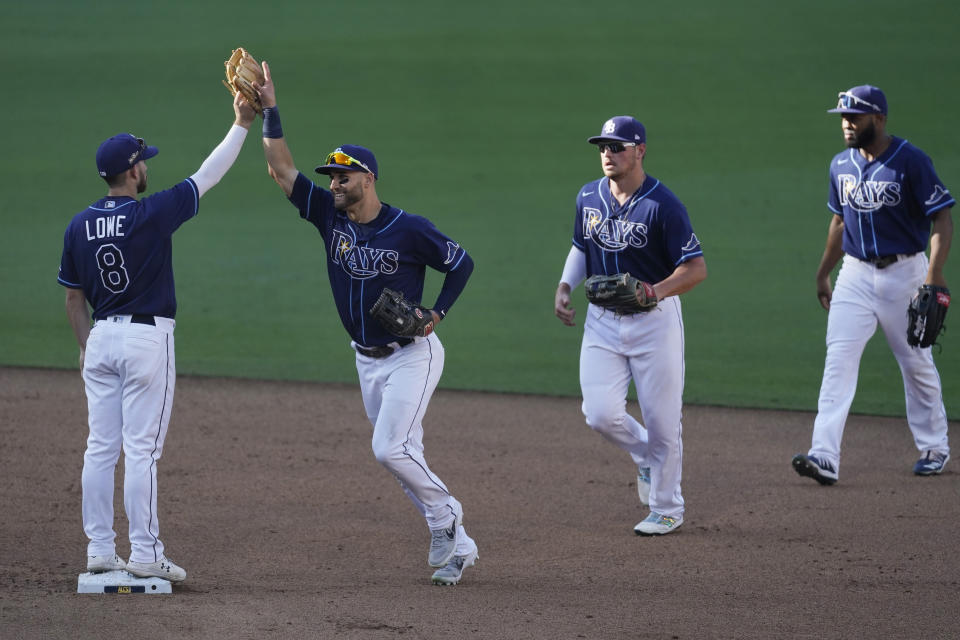 Tampa Bay Rays celebrate their Game 2 victory over the Houston Astros in a baseball American League Championship Series, Monday, Oct. 12, 2020, in San Diego. The Rays defeated the Astros 4-2 to lead the series 2-0 games. (AP Photo/Ashley Landis)