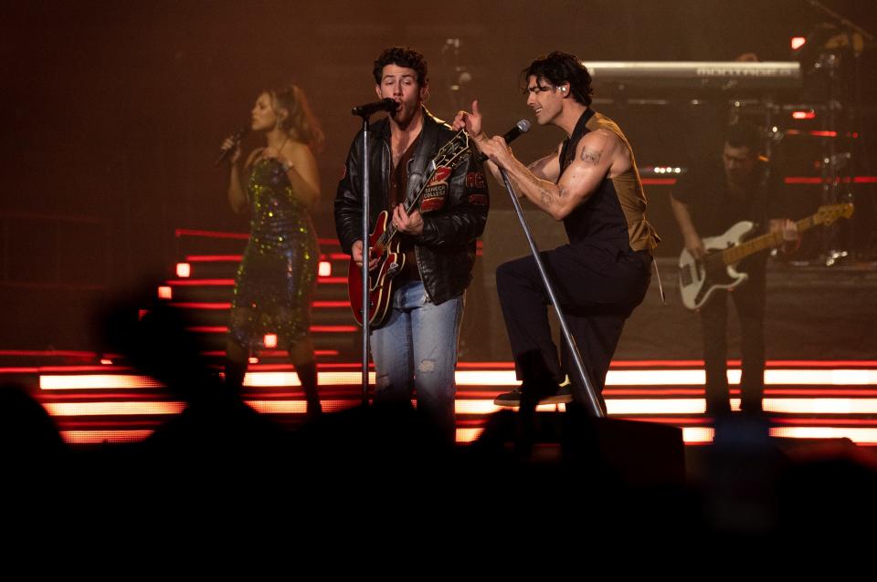 Nick Jonas, left, and Joe Jonas perform with the Jonas Brothers at Bridgestone Arena in Nashville, Tenn., Monday, Oct. 9, 2023.