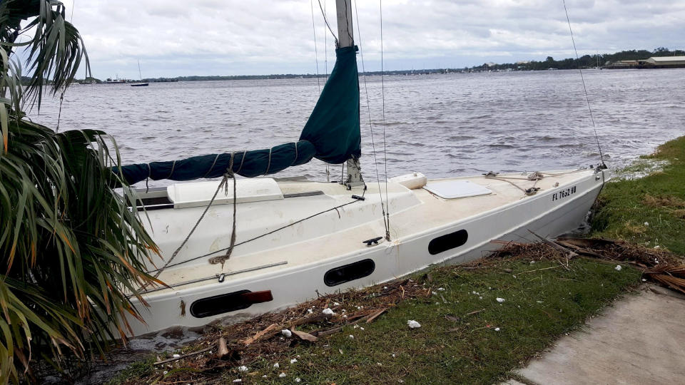 Some sailboats moored in the city's rivers broke loose and crashed against the banks.