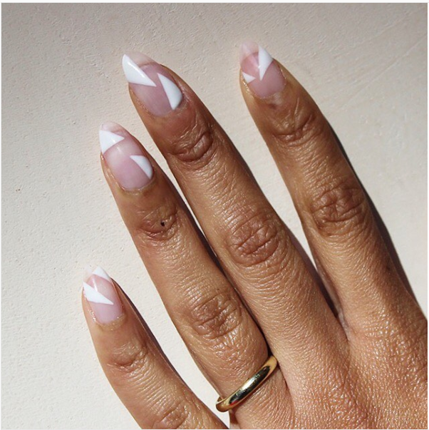 <p>The negative space trend strikes again, this time with bold white triangles against a clear background. </p><p><strong>See more at <a rel="nofollow noopener" href="https://www.instagram.com/p/BeRoxzpn_Nu/?taken-by=paintboxnails" target="_blank" data-ylk="slk:Paintbox;elm:context_link;itc:0;sec:content-canvas" class="link ">Paintbox</a>. </strong><br></p>