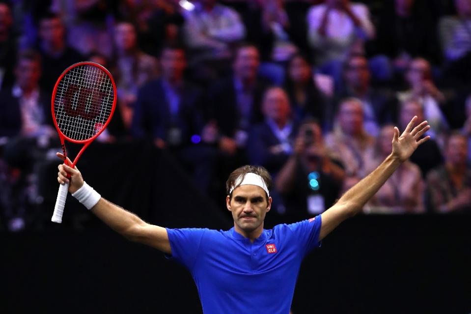 Roger Federer defeats John Isner to leave Europe on the brink of success over Team World at the Laver Cup (AFP Photo/CLIVE BRUNSKILL)