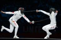 South Korea's Shin A Lam (R) fences against China's Sun Yujie during their Women's Epee bronze medal bout as part of the fencing event of London 2012 Olympic games, at the ExCel centre in London