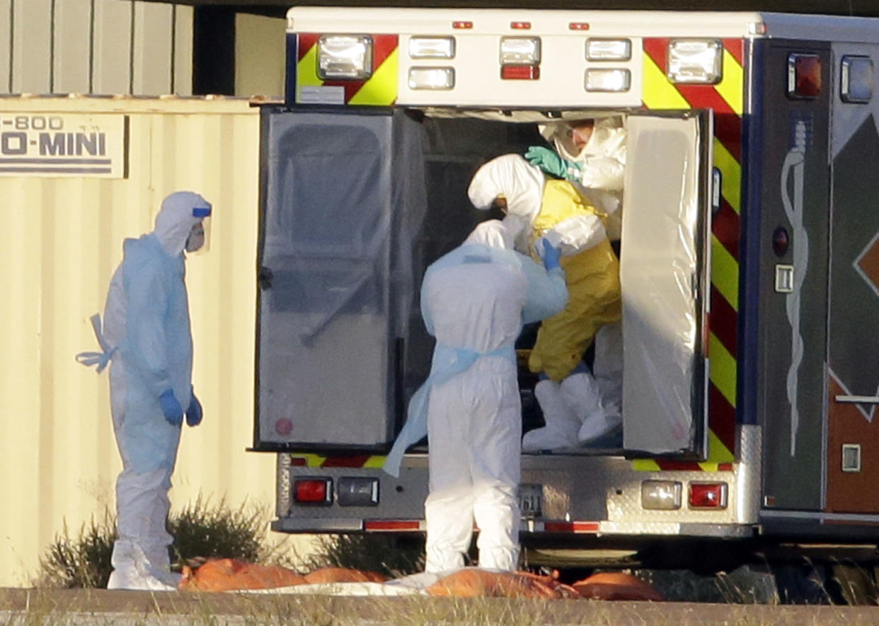 Baylor Scott & White said it is upgrading its protective equipment to be like what was worn to transport Ebola patient Nina Pham to Maryland. (AP/Tony Gutierrez)