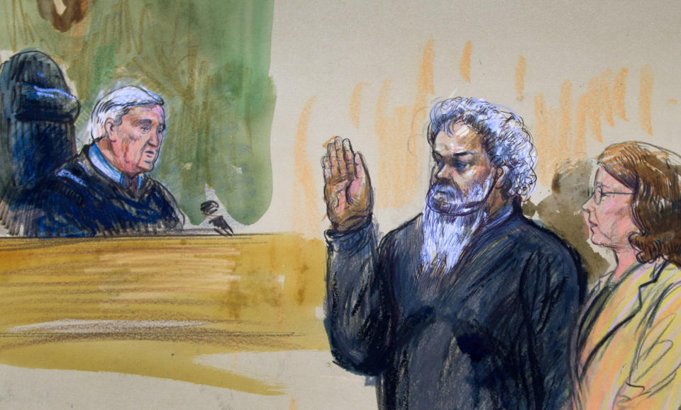 FILE - This June 28, 2014, artist's rendering shows United States Magistrate, Judge John Facciola, swearing in the defendant, Libyan militant Ahmed Abu Khatallah, wearing a headphone, as his attorney Michelle Peterson watches during a hearing at the federal U.S. District Court in Washington. (AP Photo/Dana Verkouteren)