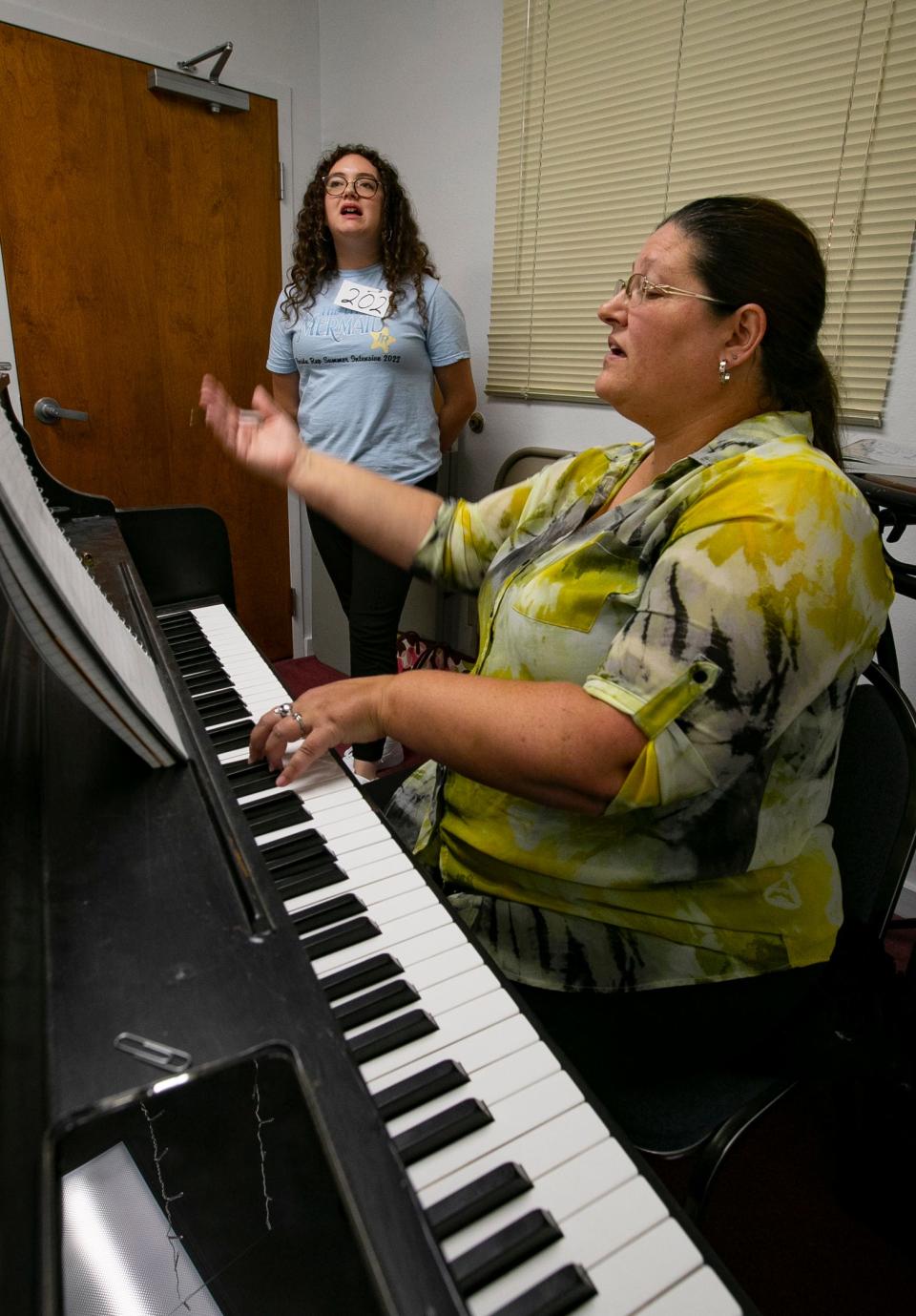 Giana Randall sings along with pianist Carrie Guffy during a a theater tryout. Cultural Park Theater hosted auditions for its 60th anniversary season on Thursday, August 11, 2022. The theater has lowered its ticket prices and started selling tickets online. New changes for the season also included a renovated lobby with new TV monitors and Art Deco decor currently under construction. 