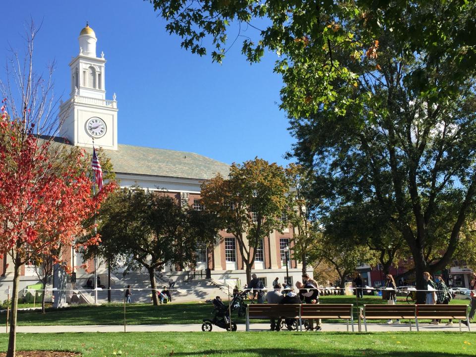 Visitors rest Oct. 17, 2020 on new benches that are part of the revamped City Hall Park in Burlington.