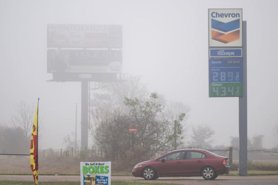 A sign at a gas station shows prices of $2.89 for regular and $4.34 for diesel.