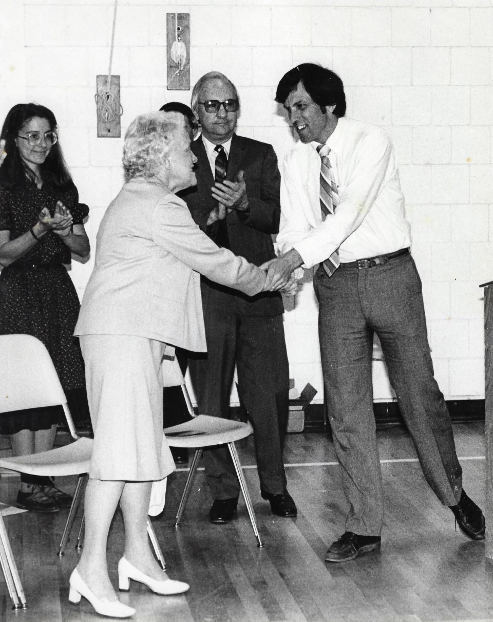 Tom Farrell, right, shakes hands with U.S. Sen. Margaret Chase Smith at one point during his career as a Maine educator. Farrell, who once served as superintendent of RSU 21, died on March 17, 2024.