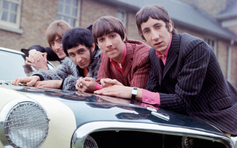 During a break in filming for a German TV programme they lean on the bonnet of Roger Daltrey's Volvo P1800 Coupe