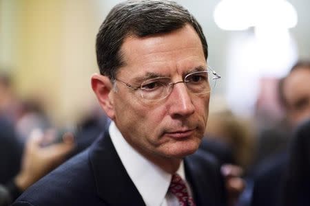 Senator John Barrasso (R-WY) speaks to the media after the Republican policy luncheon on Capitol Hill in Washington December 18, 2012. REUTERS/Joshua Roberts