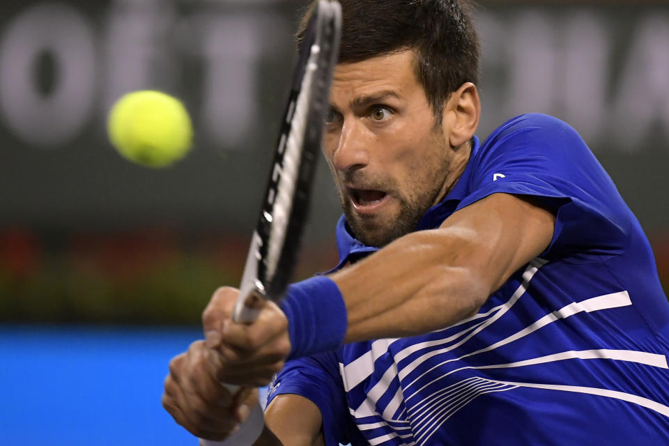 Novak Djokovic, of Serbia, returns to Bjorn Fratangelo at the BNP Paribas Open tennis tournament Saturday, March 9, 2019, in Indian Wells, Calif. (AP Photo/Mark J. Terrill)