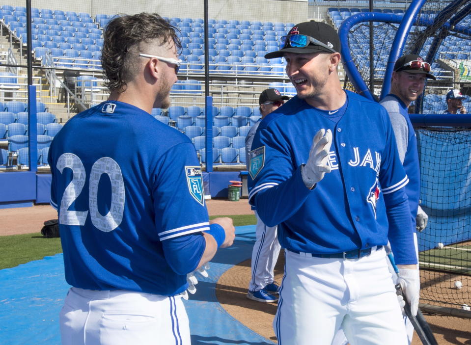 Toronto Blue Jays’ Josh Donaldson, left, talks with teammate Troy Tulowitzki at baseball spring training in Dunedin, Fla in February (The Canadian Press via AP).