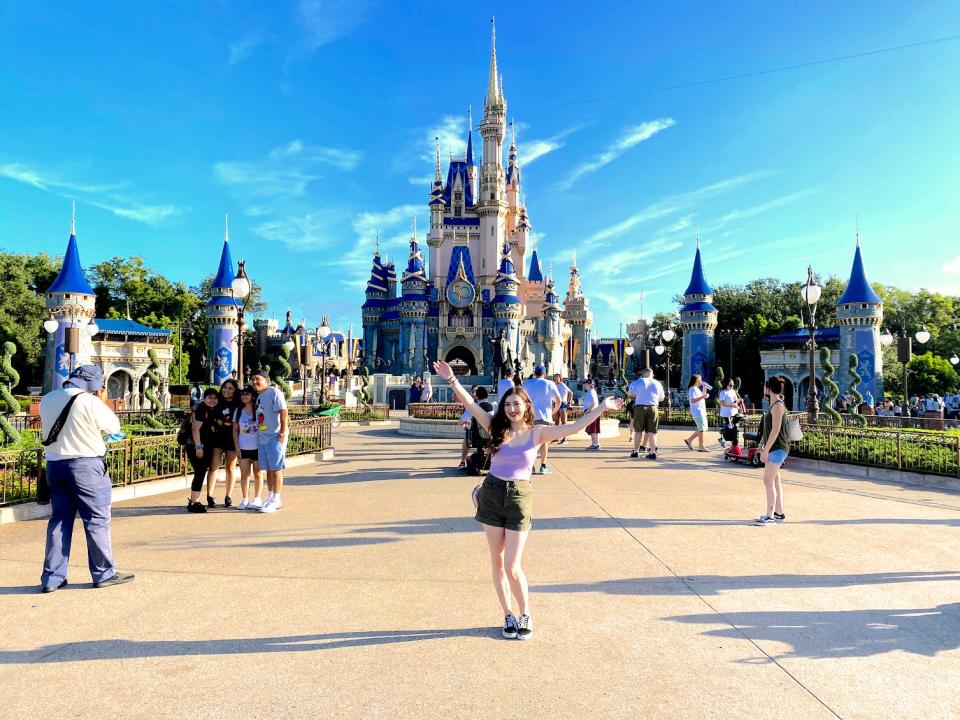 Insider reporter Amanda Krause poses in front of Disney World's Cinderella Castle.