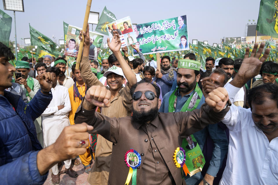Supporters of Pakistan's former Prime Minister Nawaz Sharif dance on a traditional drum beat as they arrive to attend a welcoming rally for their leader, in Lahore, Pakistan, Saturday, Oct. 21, 2023. Sharif was returning home Saturday on a special flight from Dubai, ending four years of self-imposed exile in London as he seeks to win the support of voters ahead of parliamentary elections due in January. (AP Photo/K.M. Chaudary)