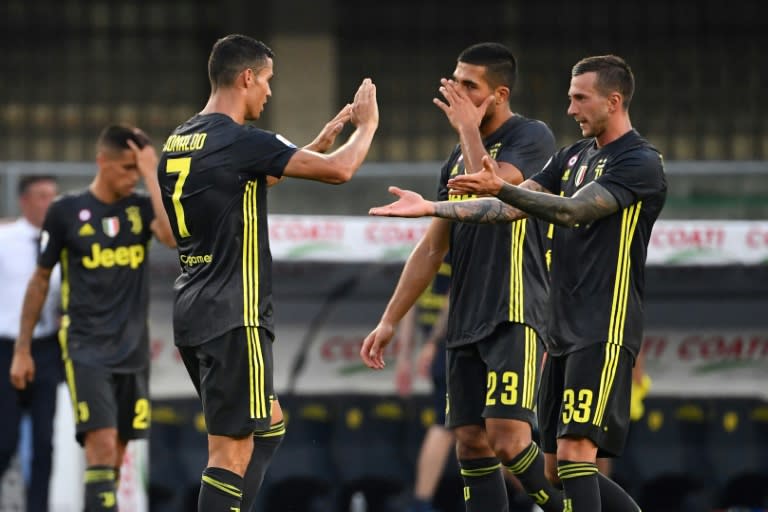 Cristiano Ronaldo celebrates with Federico Bernardeschi who scored the winner for Juventus at Chievo