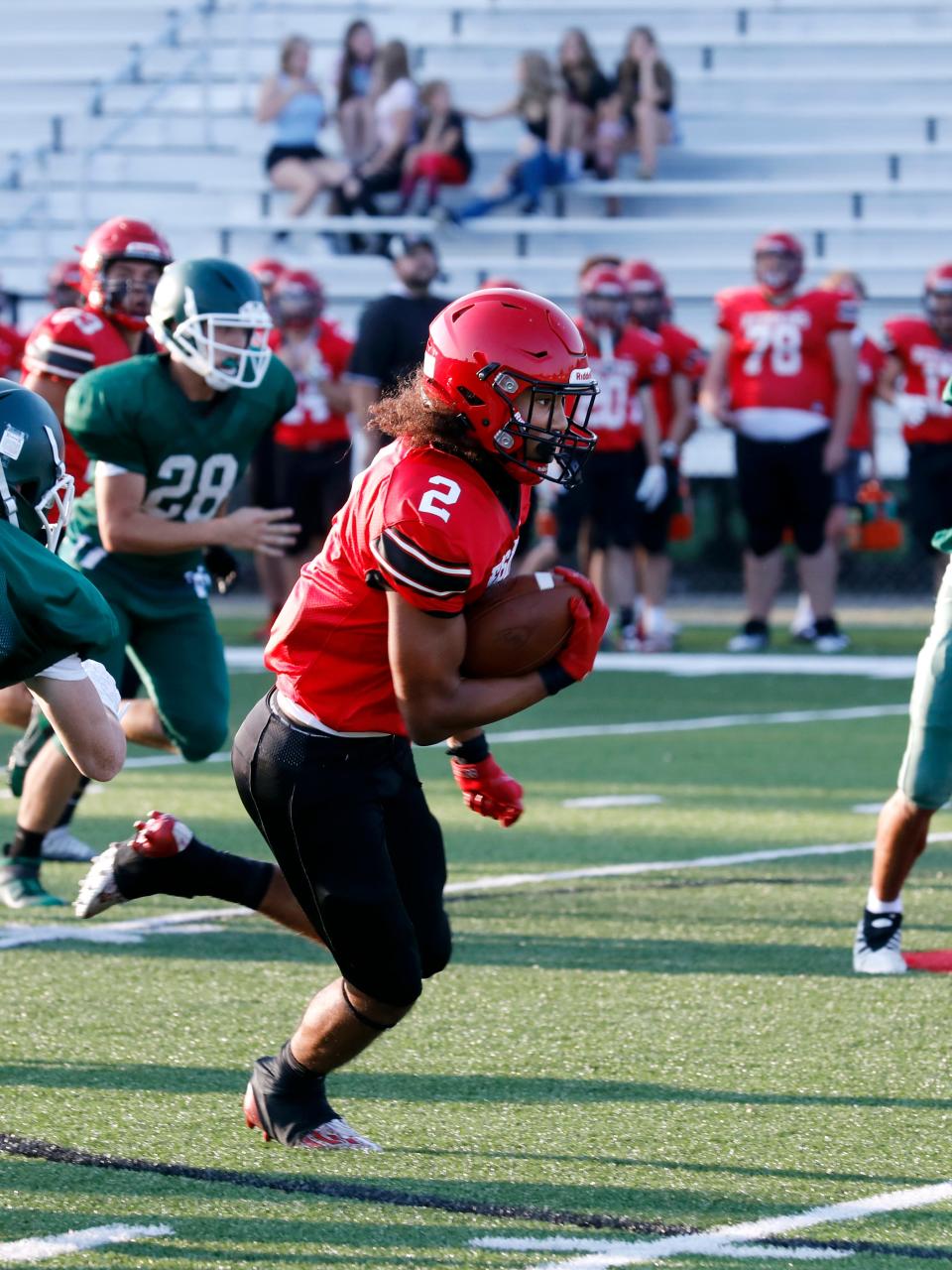 Coshocton's Israel Rice breaks loose for a long run during an Ohio High School football scrimmage against visiting Malvern on Aug. 10, 2023, at Stewart Field.