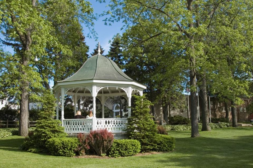 white gazebo, spring romance in lush city park