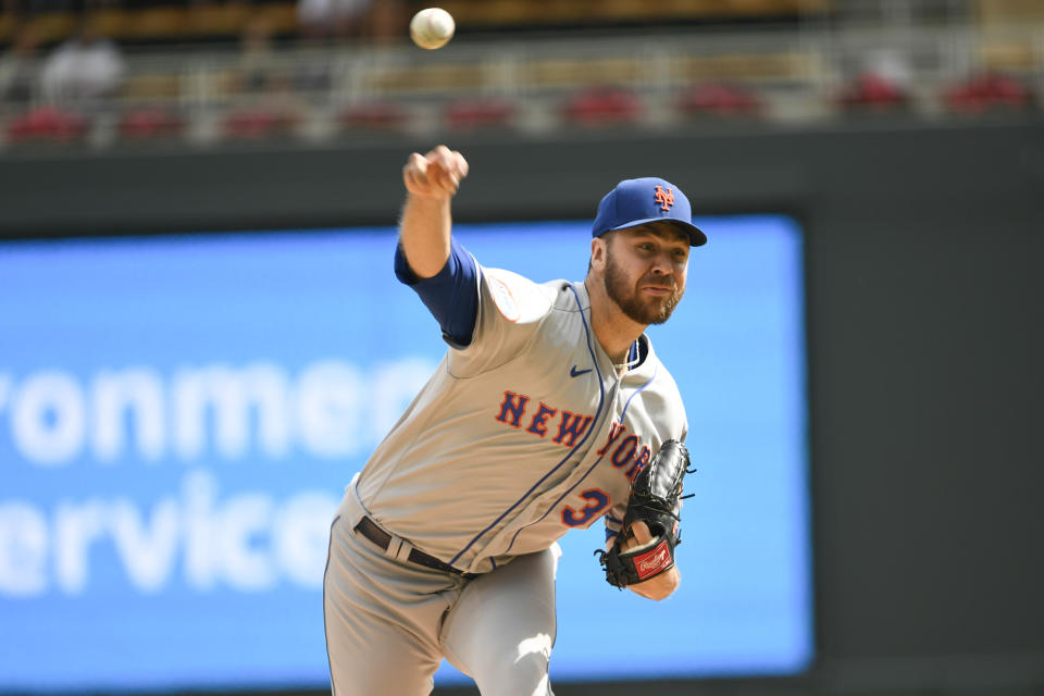 New York Mets pitcher Tylor Megill throws against the Minnesota Twins during the first inning of a baseball game, Sunday, Sept. 10, 2023, in Minneapolis. (AP Photo/Craig Lassig)