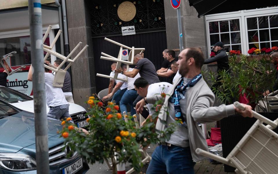 Fans throwing plastic chairs