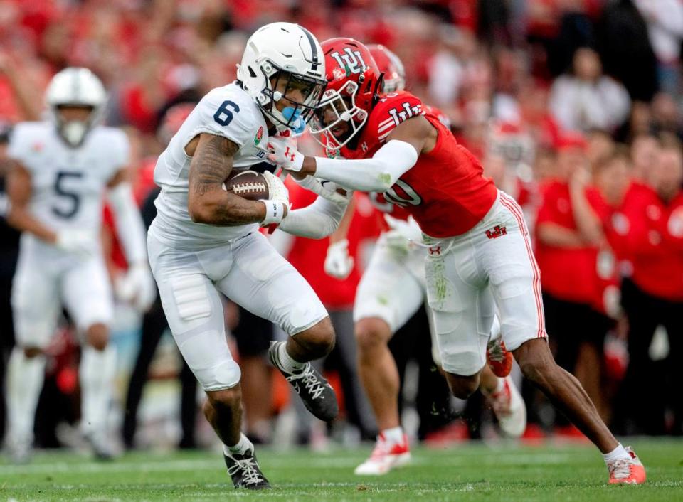 A Utah defender tries to stop Penn State wide receiver Harrison Wallace III after he makes a catch during the Rose Bowl game on Monday, Jan. 2, 2023.