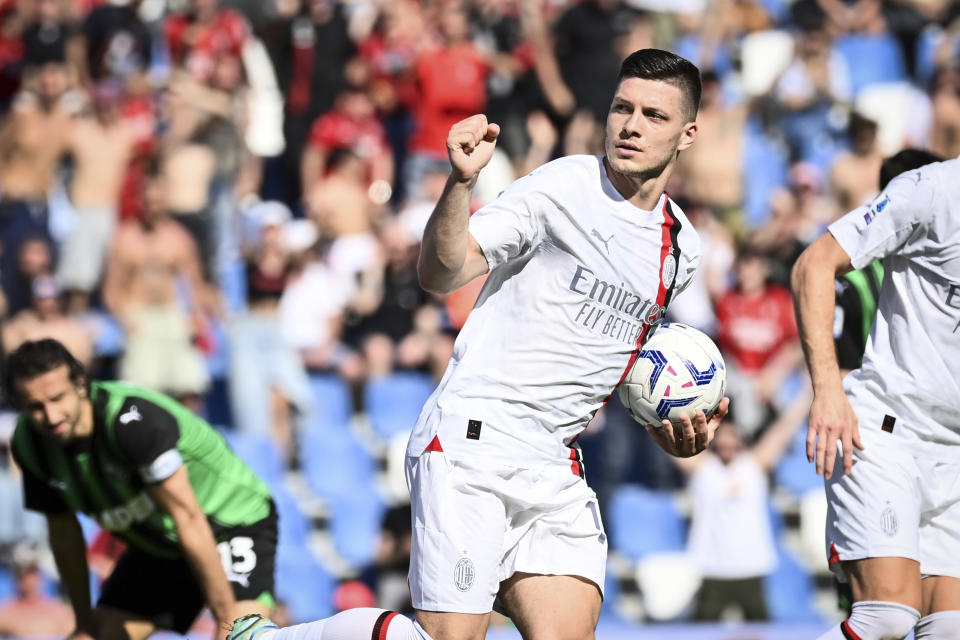 Milan's Luka Jovic celebrates after scoring their side's second goal of the game during the Serie A soccer match between Sassuolo and Milan at Mapei Stadium in Sassuolo, Italy, Sunday April 14, 2024 (Massimo Paolone/LaPresse)