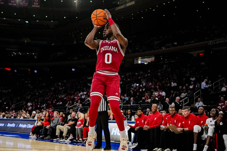 Indiana guard Xavier Johnson attempts a midrange jump shot in an NCAA college basketball game against Louisville in the Empire Classic tournament in New York, Monday, Nov. 20, 2023. (AP Photo/Peter K. Afriyie)