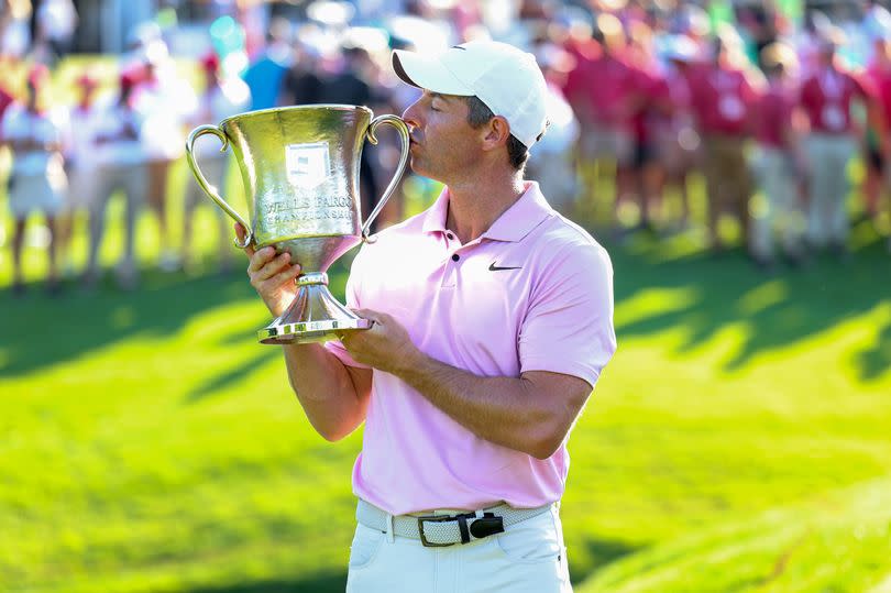 A picture of Rory McIlroy celebrating with the trophy after winning the Wells Fargo Championship