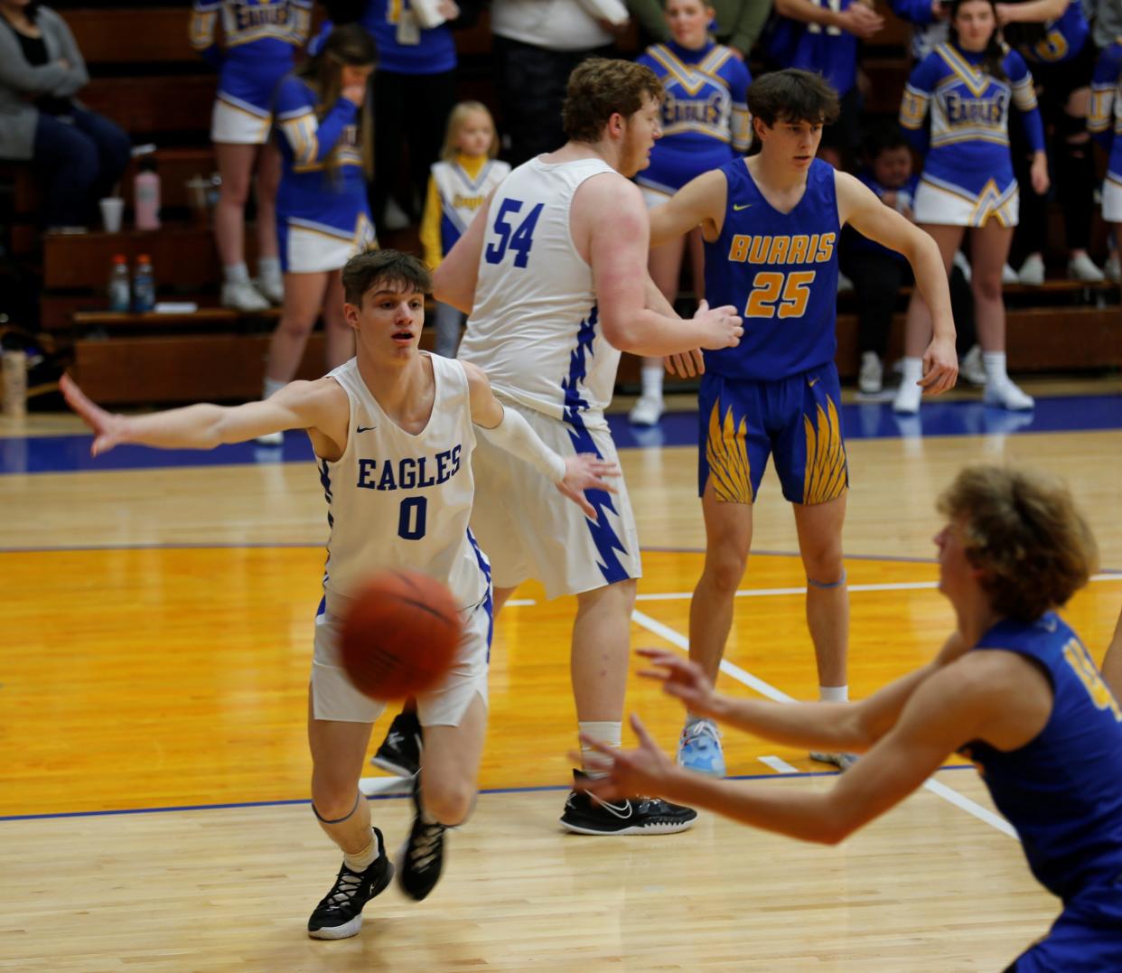 Lincoln junior Tyler Wyles (0) closes out on a Burris shooter Dec. 4, 2021. Coming into the game, Wyles was the Golden Eagles' second-leading scorer, averaging 13 points a game.