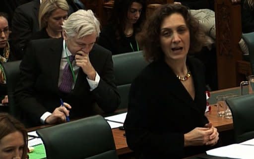 WikiLeaks chief Julian Assange (left) sits in the Supreme Court in London as his attorney Dinah Rose (right) speaks during his appeal against extradition in February. Britain's Supreme Court ruled Wednesday that WikiLeaks founder Julian Assange can be extradited to Sweden, but his extradition was put on hold to give his lawyers a chance to re-open the case