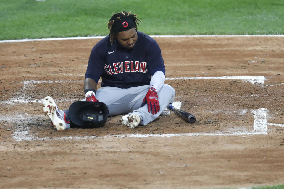 Cleveland Indians' Jose Ramirez, sits at home after striking out during the third inning of a baseball game against the Chicago White Sox Friday, Aug. 7, 2020, in Chicago. (AP Photo/Charles Rex Arbogast)