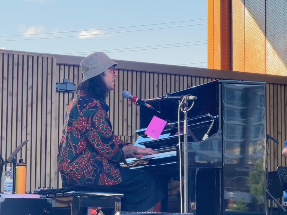 Jeremy Dutcher, an artist from Neqotkuk First Nation, preformed at the square's grand opening on Friday,