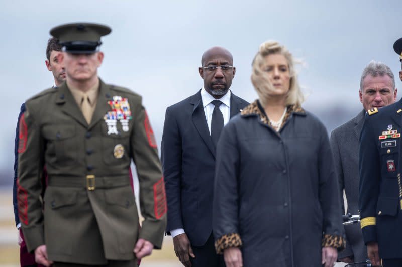 Sen. Raphael Warnock, D-Ga., attends a dignified transfer at Dover Air Force Base in Dover, Del., on Friday. Photo by Bonnie Cash/UPI