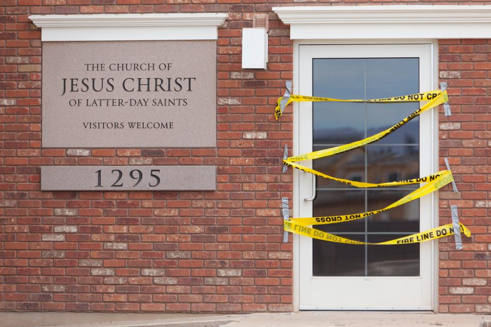 Police tape stretches across the entrance to a church building owned by The Church of Jesus Christ of Latter-day Saints in this file photo taken after a vandalism incident on Aug. 31, 2021. A more recent rash of vandalism was reported at area churches last week, with broken windows reported at 14 separate buildings.